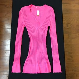 Pink V neck sweater.